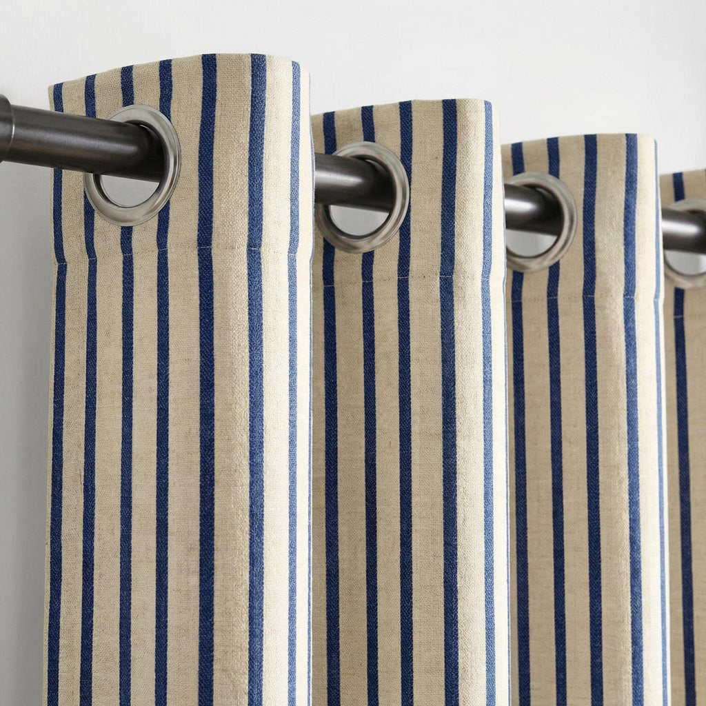 Natural beige linen-look curtains with vertical navy stripes.