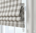 Grey and ivory check-pattern Roman shade.