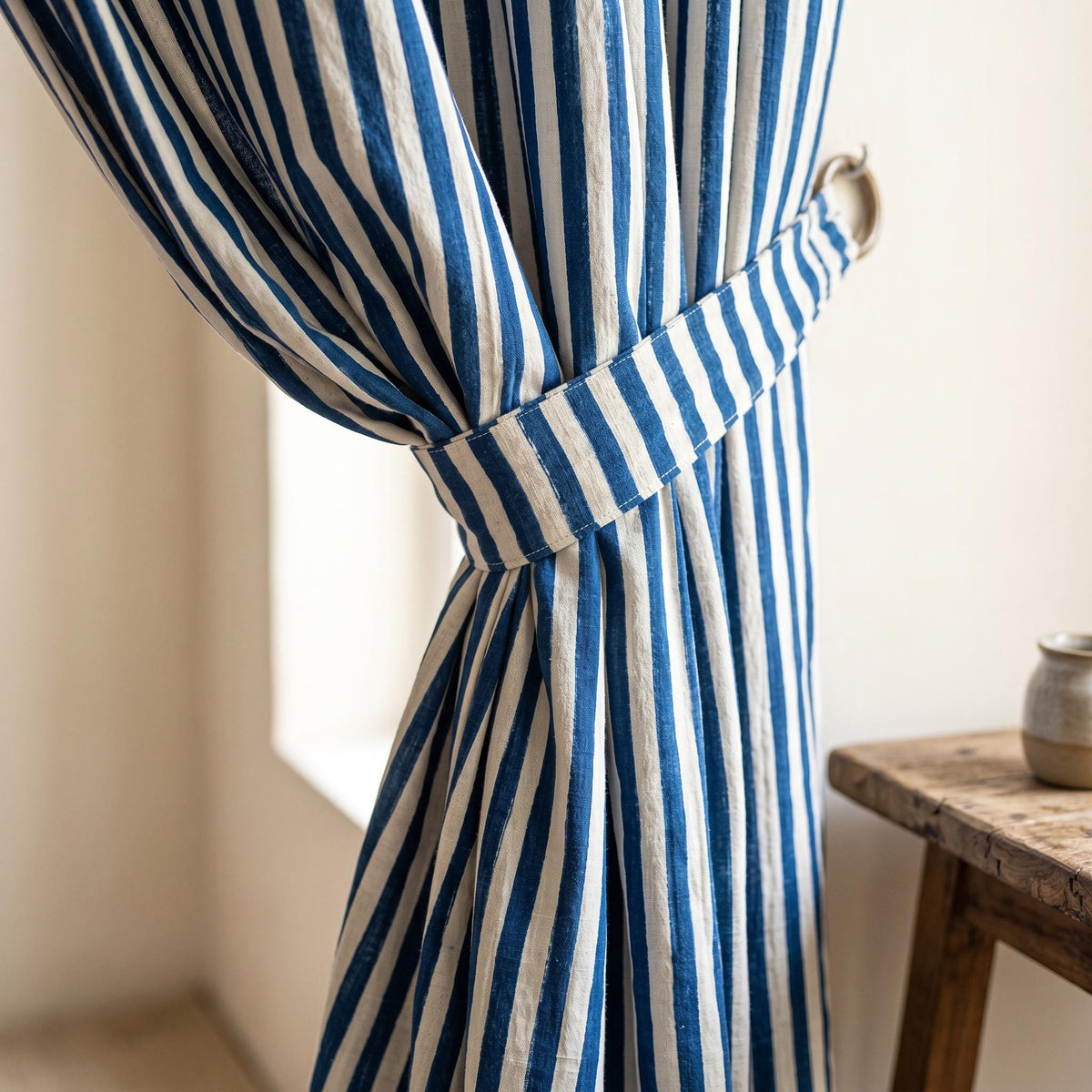 Blue and white striped hand block print curtains.
