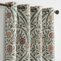 Botanical cotton curtains in ivory, soft green and warm neutral tones.